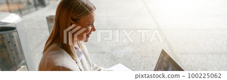 Woman freelance programer working on laptop while sitting in cafe. Data done right 100225062