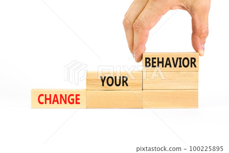 Motivation and Change your behavior symbol. Concept words Change your behavior on wooden block on a beautiful white table white background. Business change your behavior concept. Copy space. 100225895