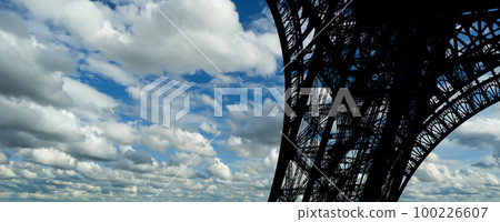 Eiffel Tower against the background of a beautiful sky with clouds. Paris, France Eiffel Tower against the background of a beautiful sky with clouds. Paris, France 100226607