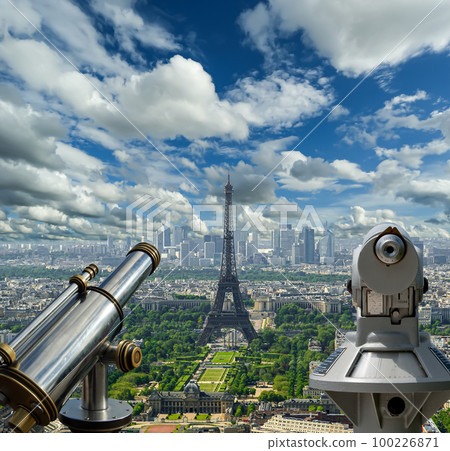 Telescope viewer and city skyline at daytime (against the background of very beautiful clouds). Paris, France. Telescope viewer and city skyline at daytime (against the background of very beautiful clouds). Paris, France. 100226871