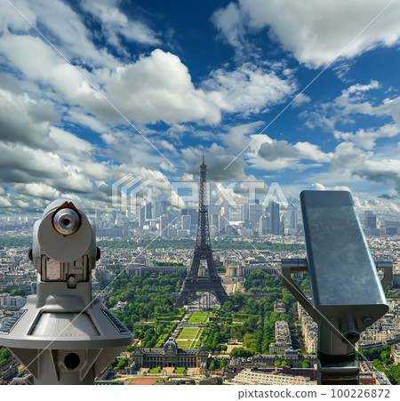 Telescope viewer and city skyline at daytime (against the background of very beautiful clouds). Paris, France. 100226872