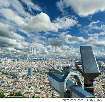 Telescope viewer and city skyline at daytime (against the background of very beautiful clouds). Paris, France. Telescope viewer and city skyline at daytime (against the background of very beautiful clouds). Paris, France. 100228022