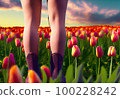 the feet of a young girl stand in a clearing dotted with flowers. 100228242