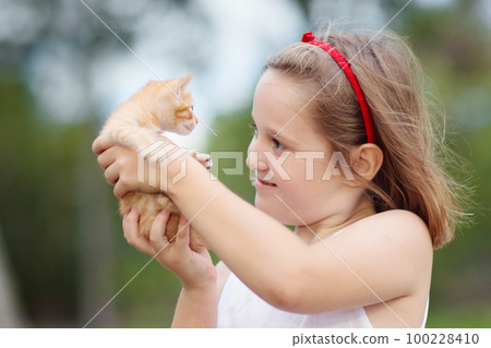 Little girl holding baby cat. Kids and pets Little girl holding baby cat. Kids and pets 100228410