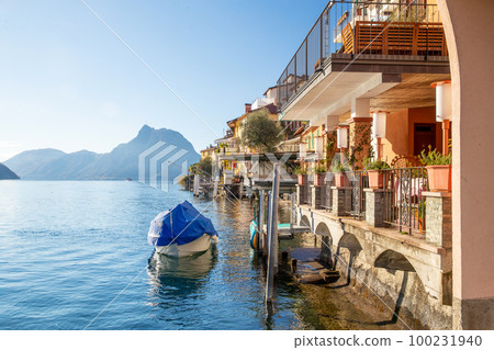 Gandria  village  in Lugano suburb - sheltered boat and houses next  to water 100231940