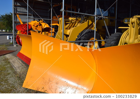 Snowplow waiting in a snowy country Snowplow waiting in a snowy country 100233829