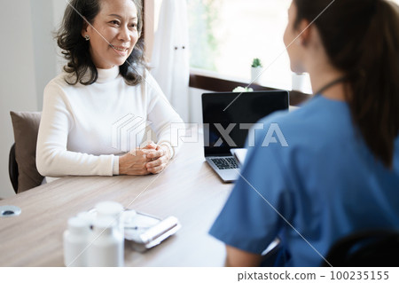 Portrait of a female doctor holding a patient clipboard to discuss and analyze the patient's condition before treating 100235155