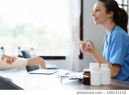 Portrait of a female doctor holding a patient clipboard to discuss and analyze wrist and finger pain 100235158