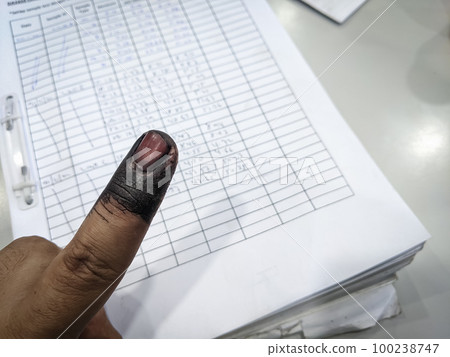 Index finger with indelible ink stain after voting in election Index finger with indelible ink stain after voting in election 100238747
