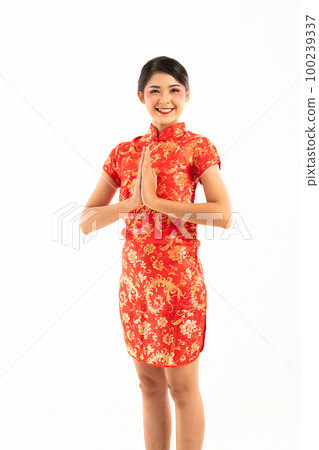 beautiful asian woman in red cheongsam standing put hands together beautiful asian woman in red cheongsam standing put hands together 100239337