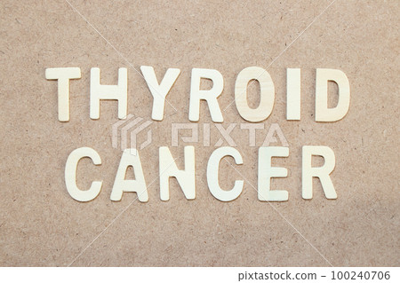 Wood alphabet letter in word thyroid cancer on wood background 100240706