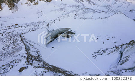 A huge ice wall from a glacier in the mountains. A huge ice wall from a glacier in the mountains. 100252378