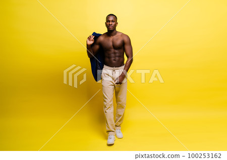 Young african man standing shirtless with a happy and cool smile on face. lucky person. Young african man standing shirtless with a happy and cool smile on face. lucky person. 100253162