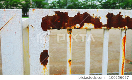 A landscape with a rusty gate and a rusty chain A landscape with a rusty gate and a rusty chain 100256057