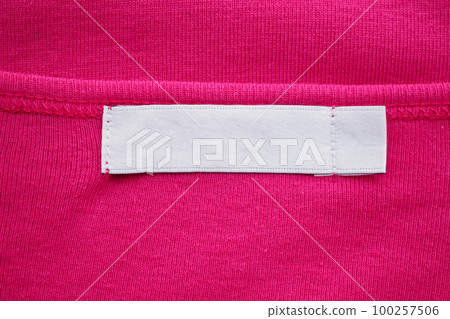 Blank white clothes tag label on new shirt Blank white clothes tag label on new shirt 100257506