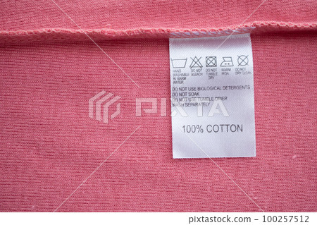 White laundry care washing instructions clothes label on cotton shirt White laundry care washing instructions clothes label on cotton shirt 100257512