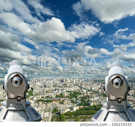 Telescope viewer and city skyline at daytime (against the background of very beautiful clouds). Paris, France. Telescope viewer and city skyline at daytime (against the background of very beautiful clouds). Paris, France. 100258585