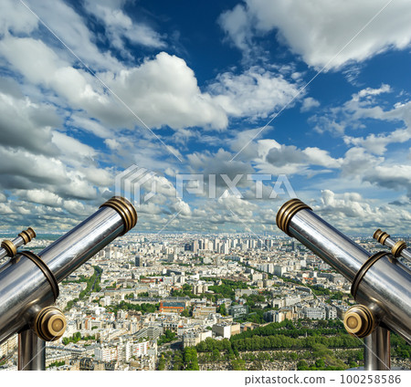 Telescope viewer and city skyline at daytime (against the background of very beautiful clouds). Paris, France. 100258586