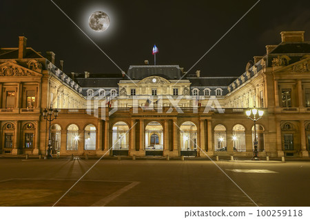 The historic center of Paris at night (with the moon), France. Building of the Council of State of France (written in French) 100259118
