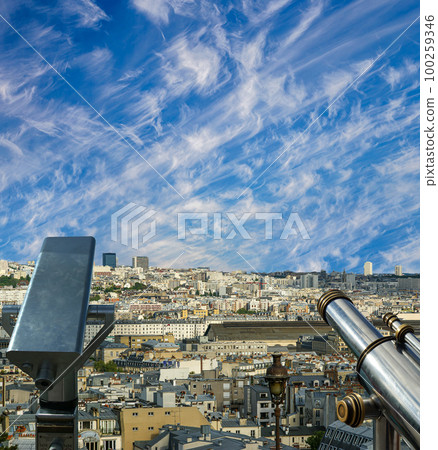 Telescope viewer and city skyline at daytime (against the background of very beautiful clouds). Paris, France. 100259346