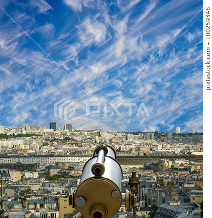 Telescope viewer and city skyline at daytime (against the background of very beautiful clouds). Paris, France. 100259348