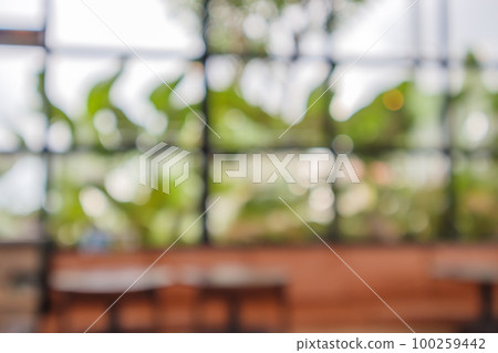 Abstract blur coffee shop or cafe restaurant background with bokeh light for montage product display 100259442