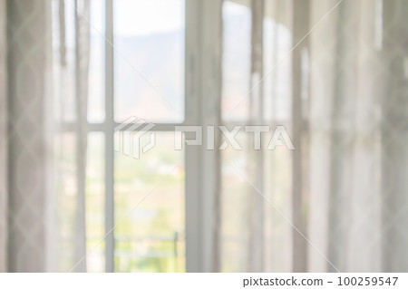window curtain with green garden abstract blur background 100259547