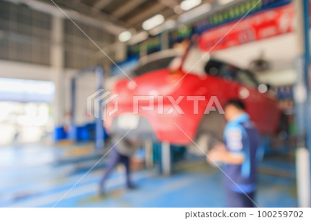 Red car lift at maintenance station in automotive service center blur abstract background Red car lift at maintenance station in automotive service center blur abstract background 100259702