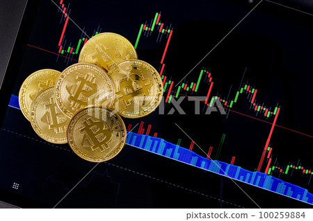 Bitcoin coins on financial charts on a tablet sceen for crypto currency prices Bitcoin coins on financial charts on a tablet sceen for crypto currency prices 100259884