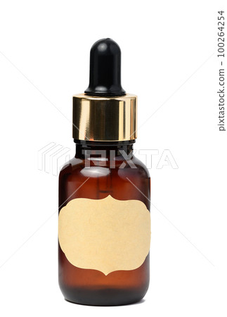 A glass brown bottle with a dropper on a white isolated background, a container for cosmetic products A glass brown bottle with a dropper on a white isolated background, a container for cosmetic products 100264254