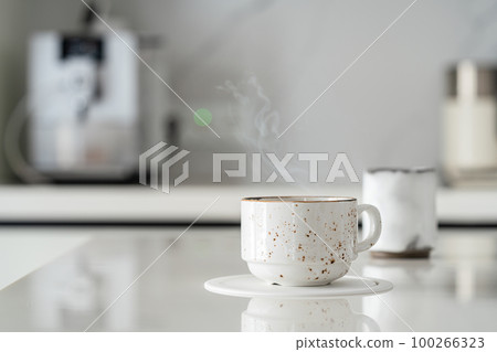 White cup on white table White cup on white table 100266323