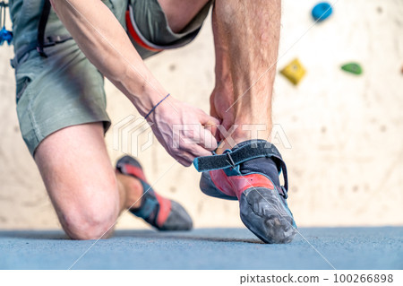 climbing shoes of an athlete in a climbing center climbing shoes of an athlete in a climbing center 100266898