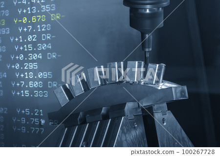 Abstract scene the 5-axis machining center cutting the water turbine blade part and G-code data background. 100267728