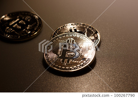 Close up bitcoins on table and reflection of light 100267790