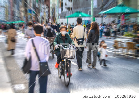 Tokyo cityscape in Japan A bicycle running through the sky. Ginza on 3.11. Pedestrian paradise crowded with people = March 11 100267936