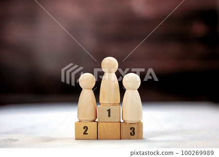 Achievement concept. Wooden podium 1, 2, 3, human standing on podium with ranking winner business and sport competition concept copy space 100269989