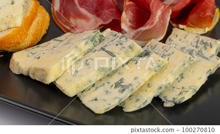 Prosciutto Tapas and Mold Cheese on Black Plate, Spanish Jamon Slices, Parma Ham, Sliced Serrano, Iberico Prosciutto Tapas and Mold Cheese on Black Plate, Spanish Jamon Slices, Parma Ham, Sliced Serrano, Iberico 100270810