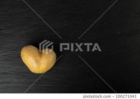 Potato Heart Top View with Copy Space, Heart Shape Potato, Love Vegetable Symbol Potato Heart Top View with Copy Space, Heart Shape Potato, Love Vegetable Symbol 100271041
