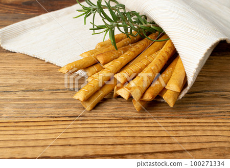 Bread Sticks on Table, Salted Breadstick, Crispy Grissini, Dry Homemade Pretzel on Wooden Background 100271334