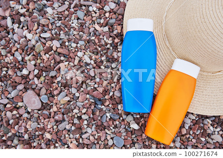 Templates of tubes of sunscreen lotion or sunblock cream and hat. Spf uv-protect cosmetic products. 100271674
