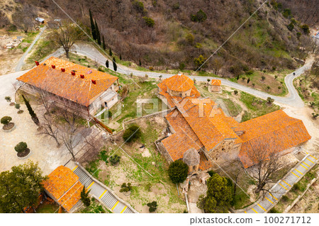 Top view of brownish tiled roofs of medieval Shio-Mgvime monastery, Mtskheta, Georgia Top view of brownish tiled roofs of medieval Shio-Mgvime monastery, Mtskheta, Georgia 100271712