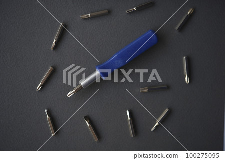 Replaceable nozzles for a screwdriver. Blue screwdriver with attachments. 100275095