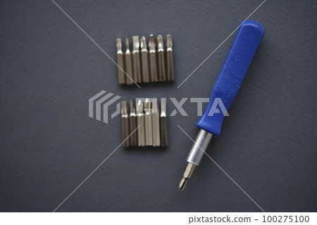 Replaceable nozzles for a screwdriver. Blue screwdriver with attachments. 100275100