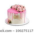 Festive birthday cake filled with pink icing and decorated with roses and macaroons isolated on white background. 100275117
