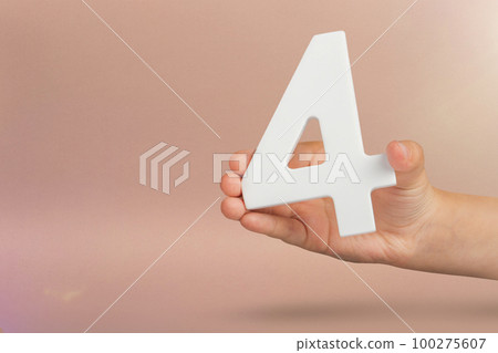 number four in hand. Hand holding white number 4 on red background with copy space. Concept with number four. Birthday 4 years, fourth grade, four day work week number four in hand. Hand holding white number 4 on red background with copy space. Concept with number four. Birthday 4 years, fourth grade, four day work week 100275607