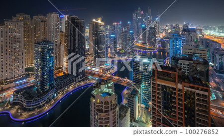 Panorama showing various skyscrapers in tallest recidential block in Dubai Marina aerial night timelapse 100276852