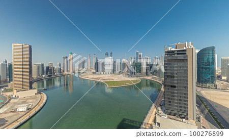 Cityscape skyscrapers of Dubai Business Bay with water canal aerial timelapse. 100276899