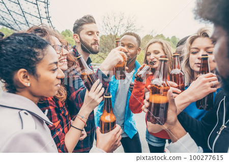 Friends having a beer together Friends having a beer together 100277615