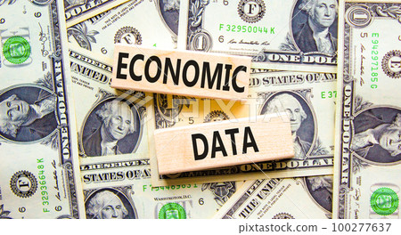 Economic data symbol. Concept words Economic data on wooden block. Beautiful background from dollar bills. Dollar bills. Business economic data concept. Copy space. Economic data symbol. Concept words Economic data on wooden block. Beautiful background from dollar bills. Dollar bills. Business economic data concept. Copy space. 100277637