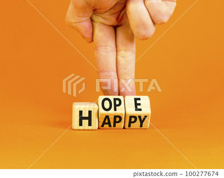 Hope and happy symbol. Concept words Hope and Happy on wooden cubes. Beautiful orange table orange background. Businessman hand. Business hope and happy concept. Copy space. 100277674
